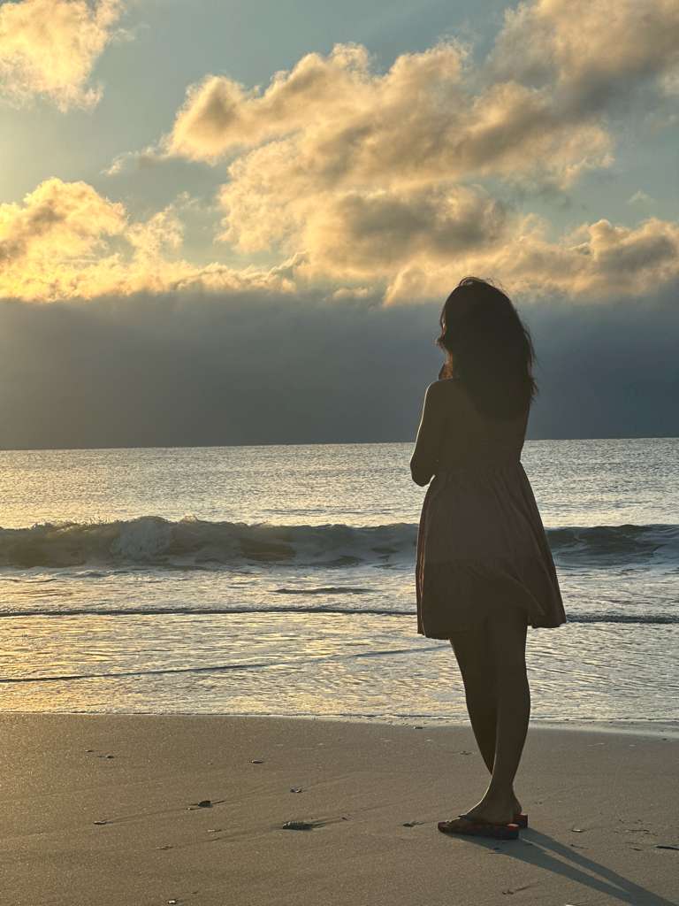 A peaceful beach with ocean waves and sand